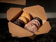 Close-up of a box filled with assorted cookies ready for delivery.