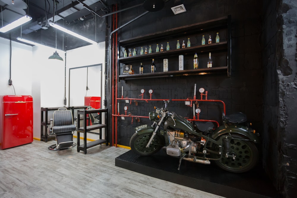 black motorcycle parked beside red truck