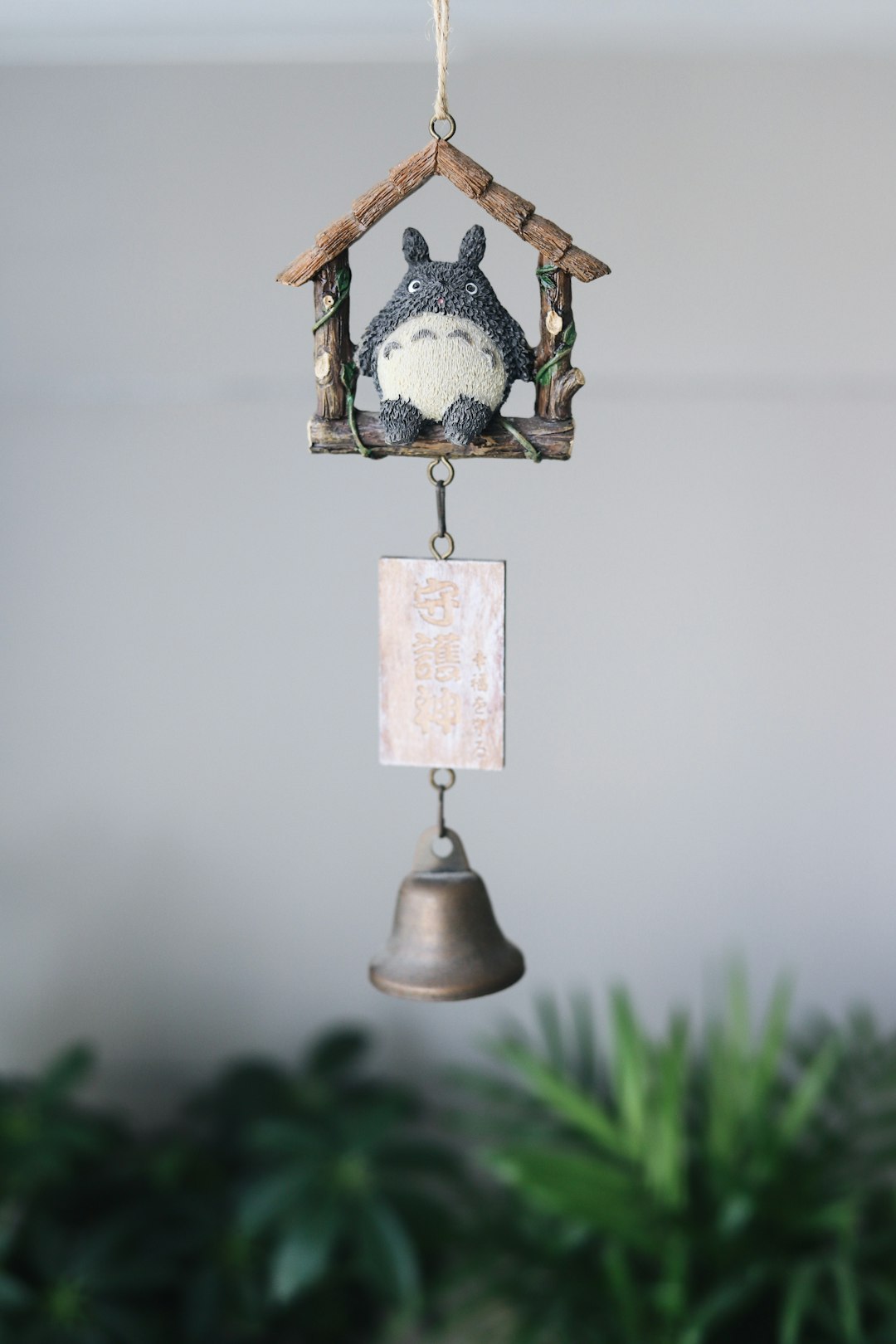 brown and white hanging bird house