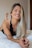 woman in black lace brassiere lying on bed