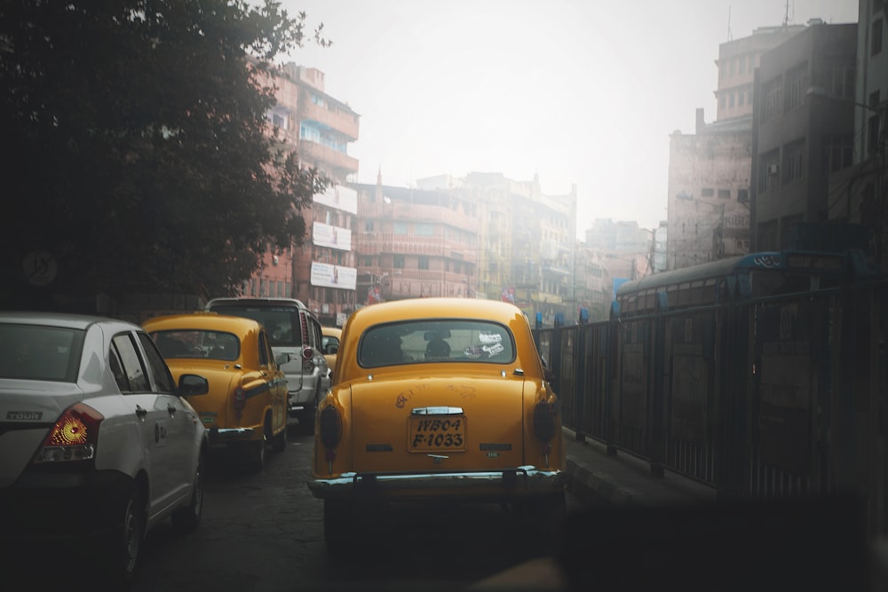 yellow car on road during daytime