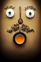 white egg beside brown wooden spoon