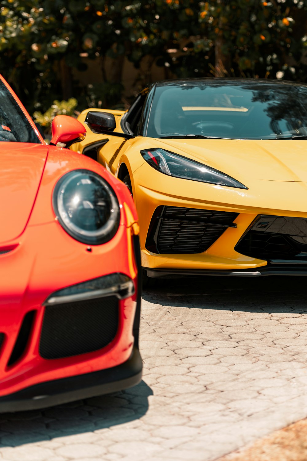 yellow lamborghini aventador parked on street during daytime