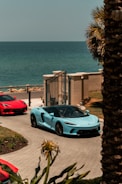 white porsche 911 parked near beach during daytime