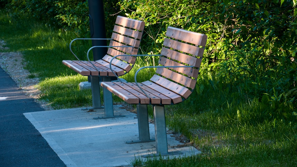 brown wooden bench on gray concrete floor