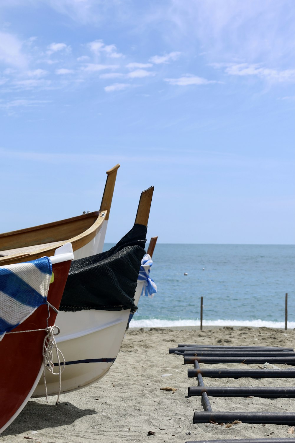 brown and white boat on beach during daytime