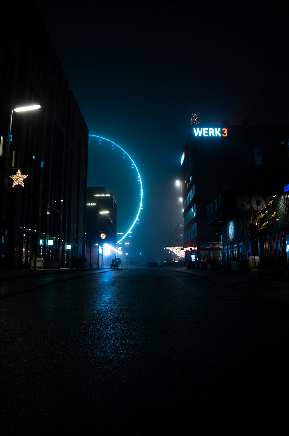 city buildings with lights during night time