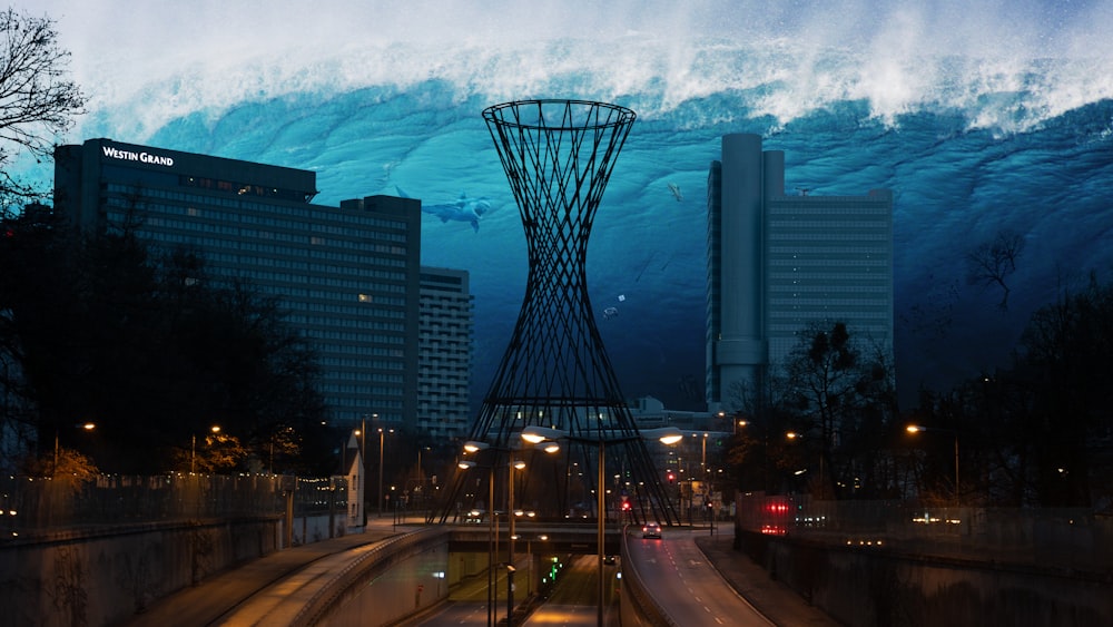 city buildings under white clouds during night time