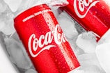 coca cola can on white plastic pack