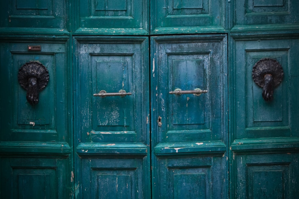 green wooden door with padlock