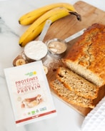banana fruit and bread on brown wooden tray