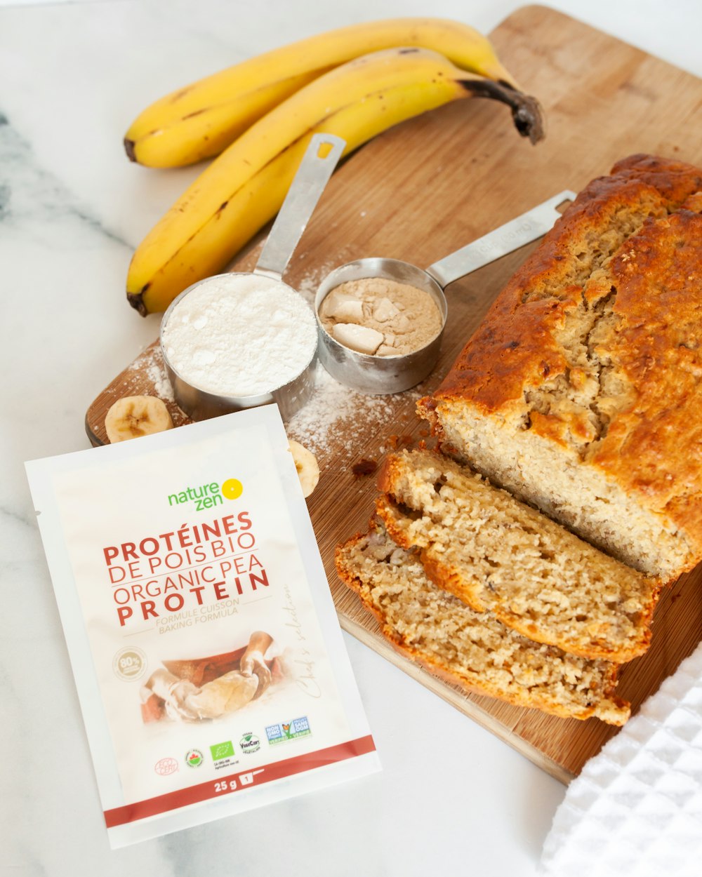 banana fruit and bread on brown wooden tray