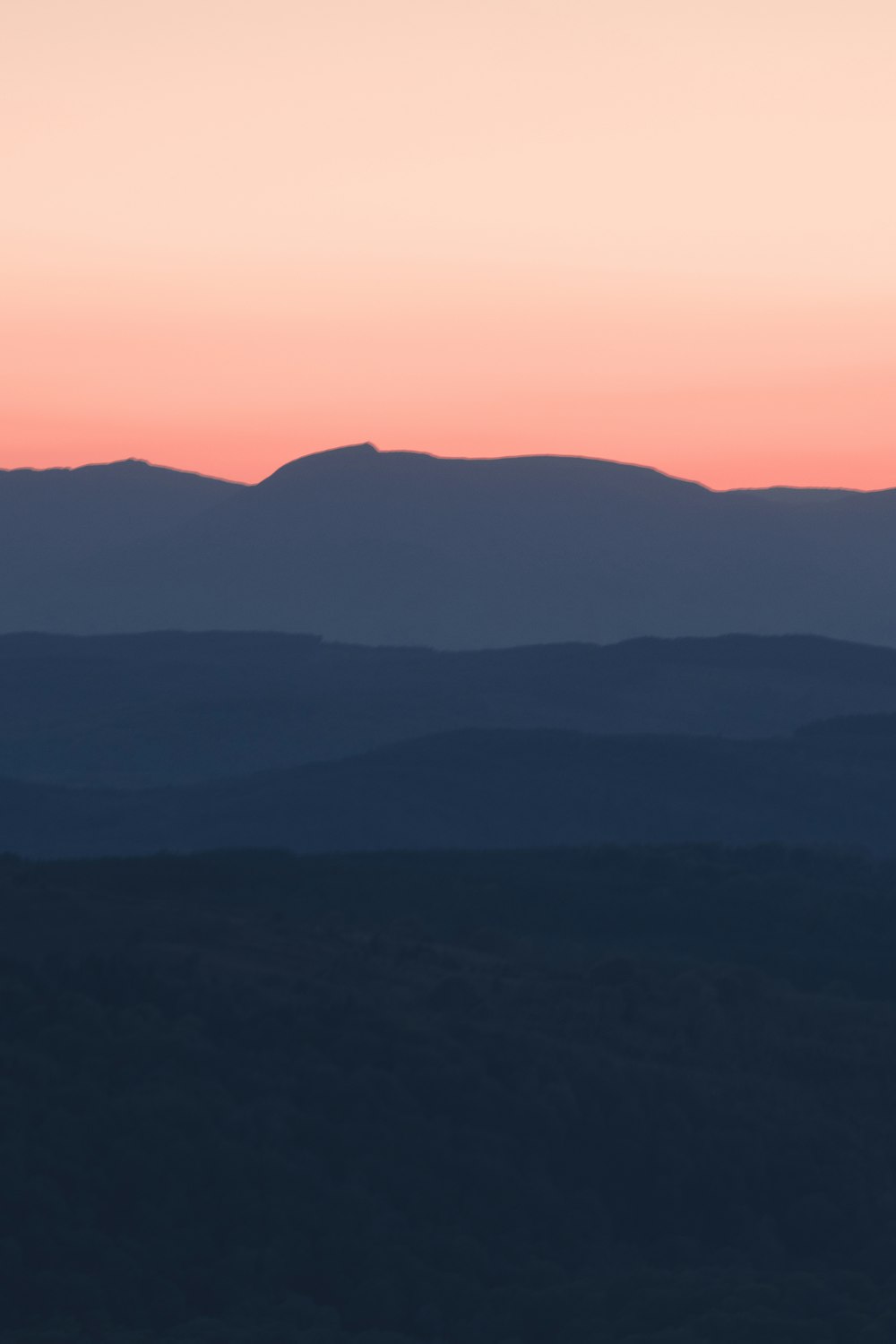 a view of a mountain range at sunset