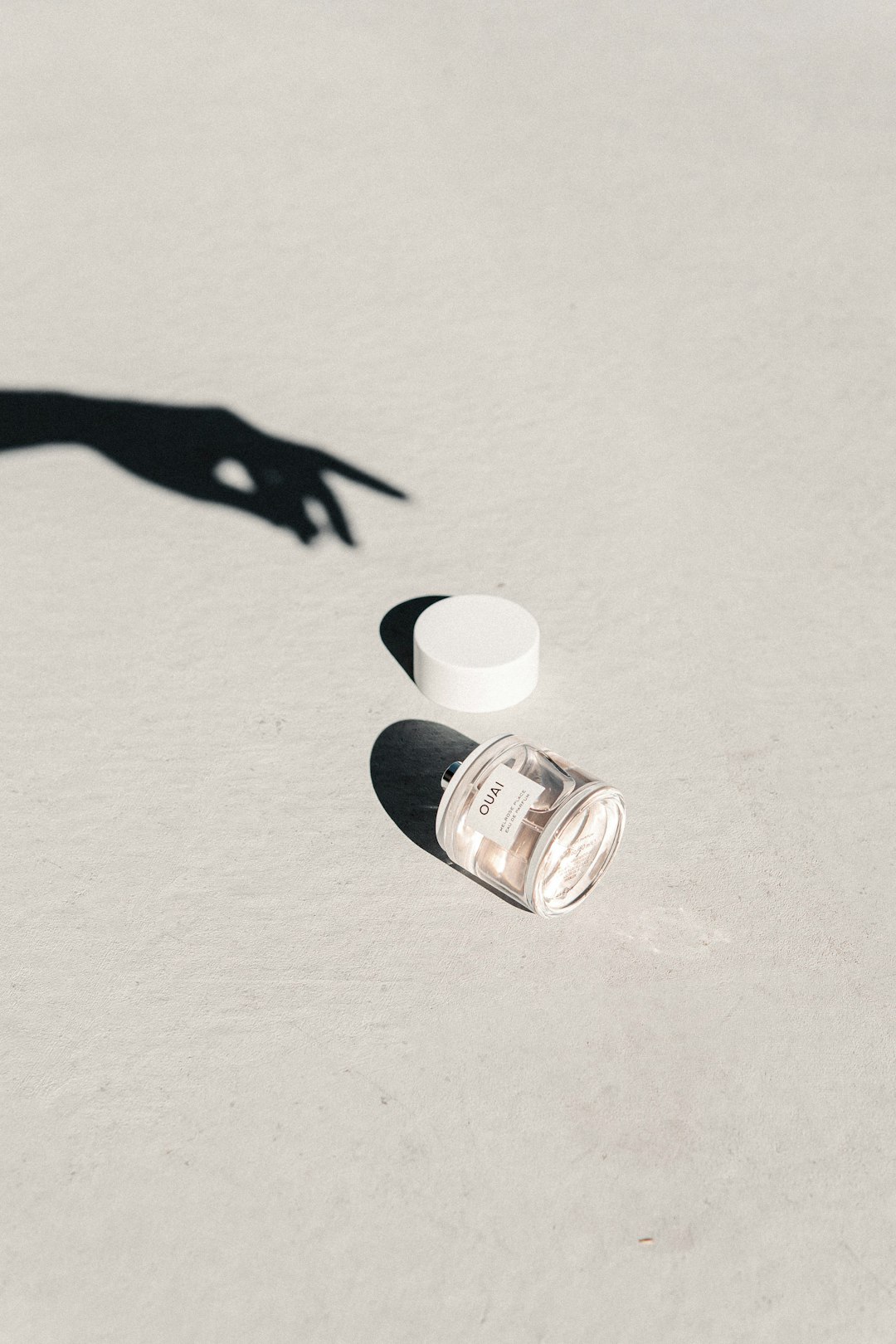 white plastic bottle on white table