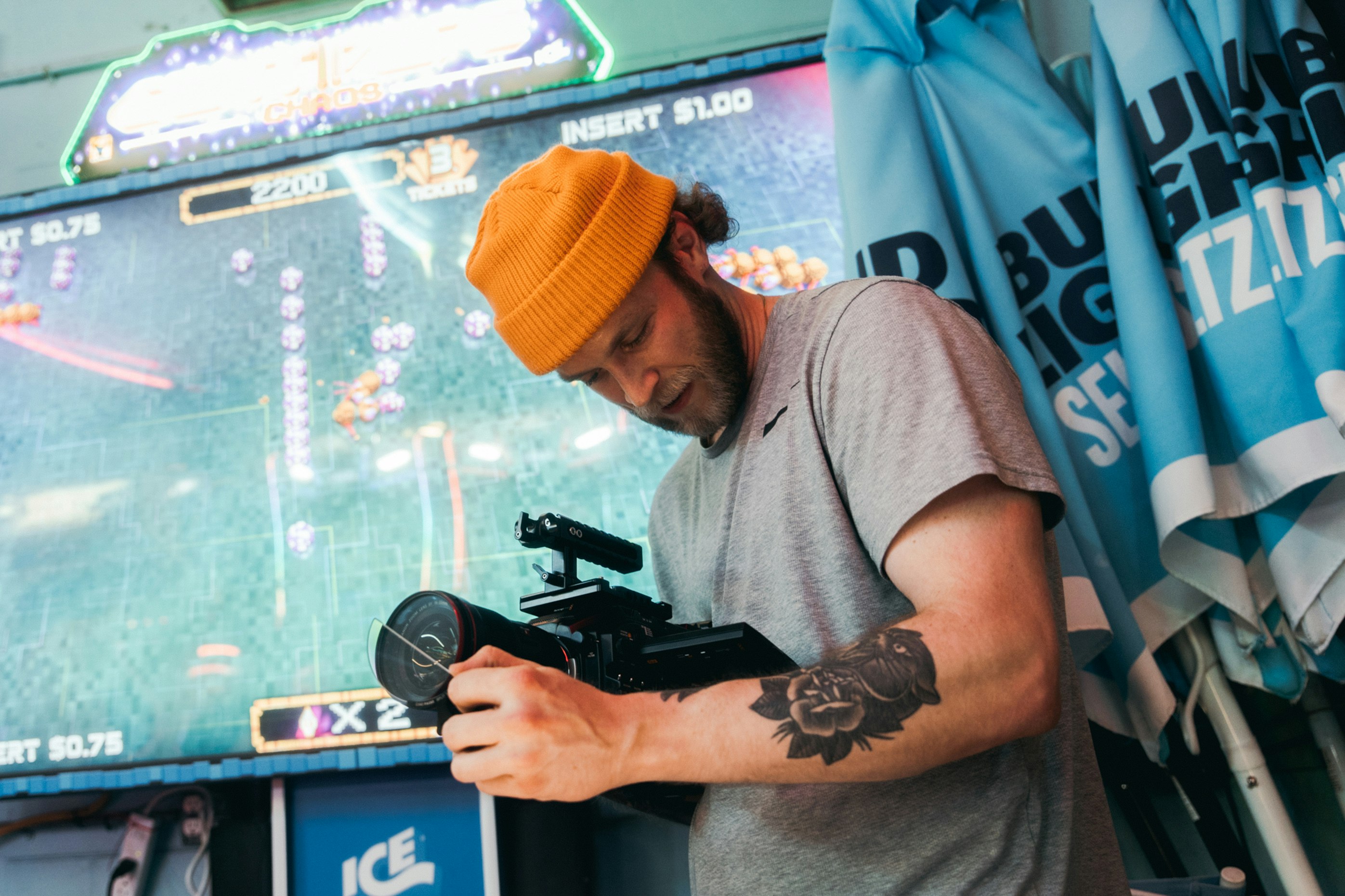 man in gray crew neck t-shirt holding black video camera