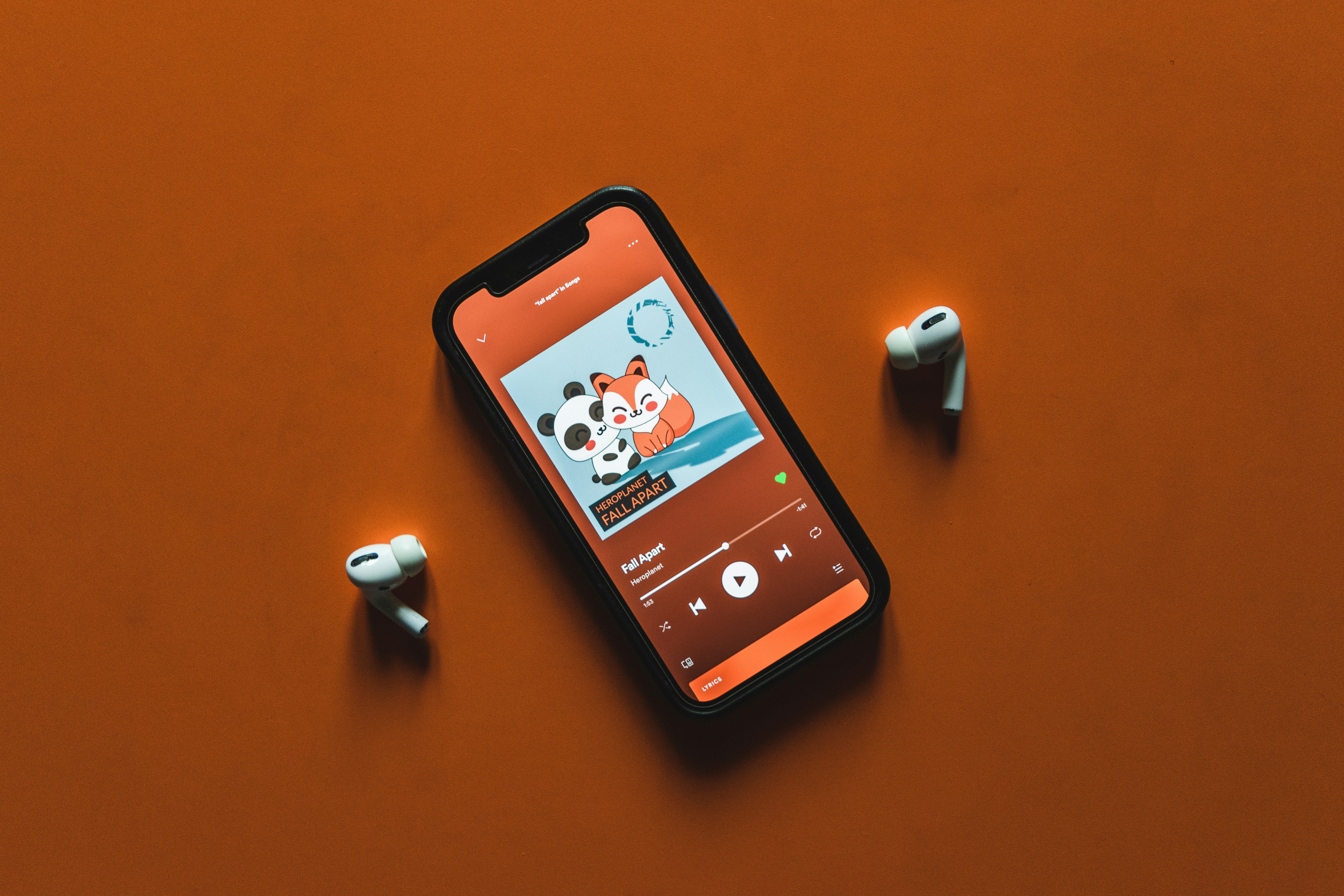 Spotify on the iPhone 12 accompanied by the AirPods Pro