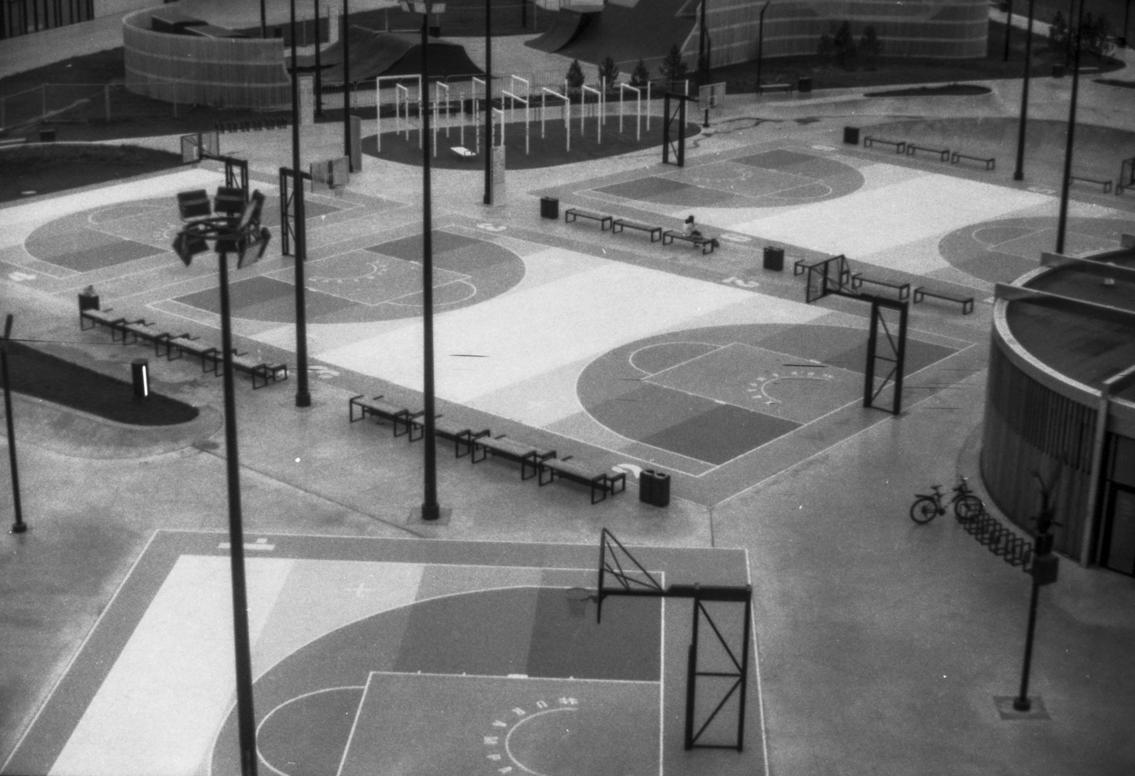 grayscale photo of basketball court