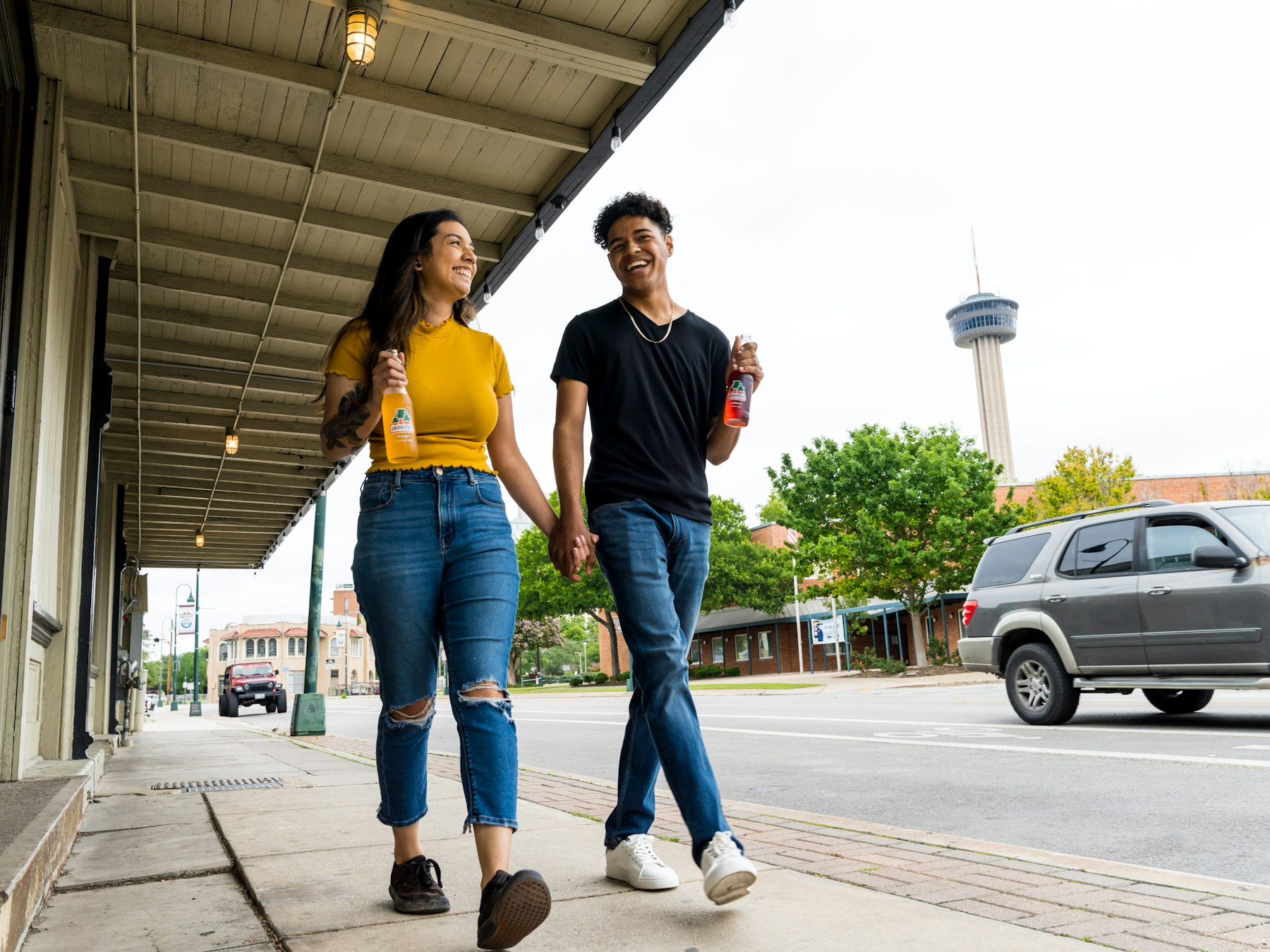 A young couple standing close together outdoors