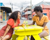 man and woman sitting on chair in front of table with yellow table cloth