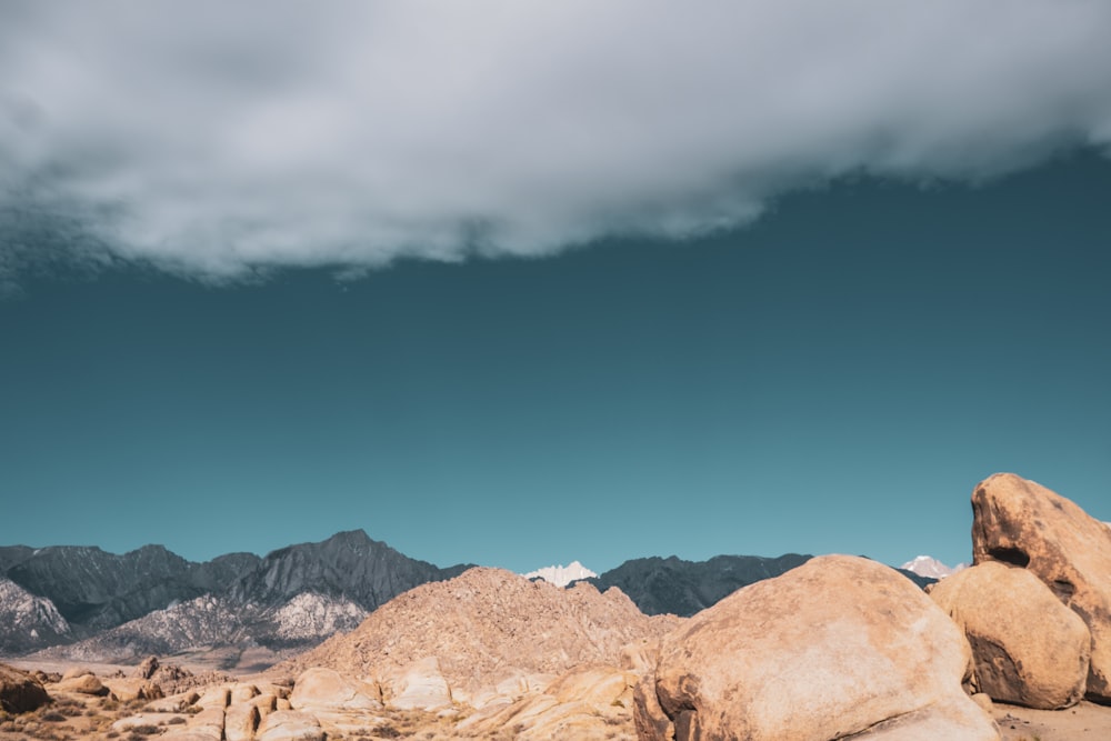 brown rocky mountain under blue sky during daytime