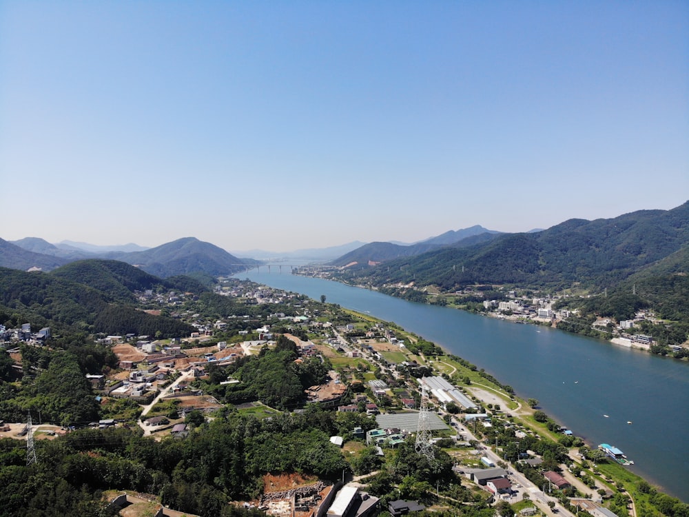 aerial view of city near body of water during daytime