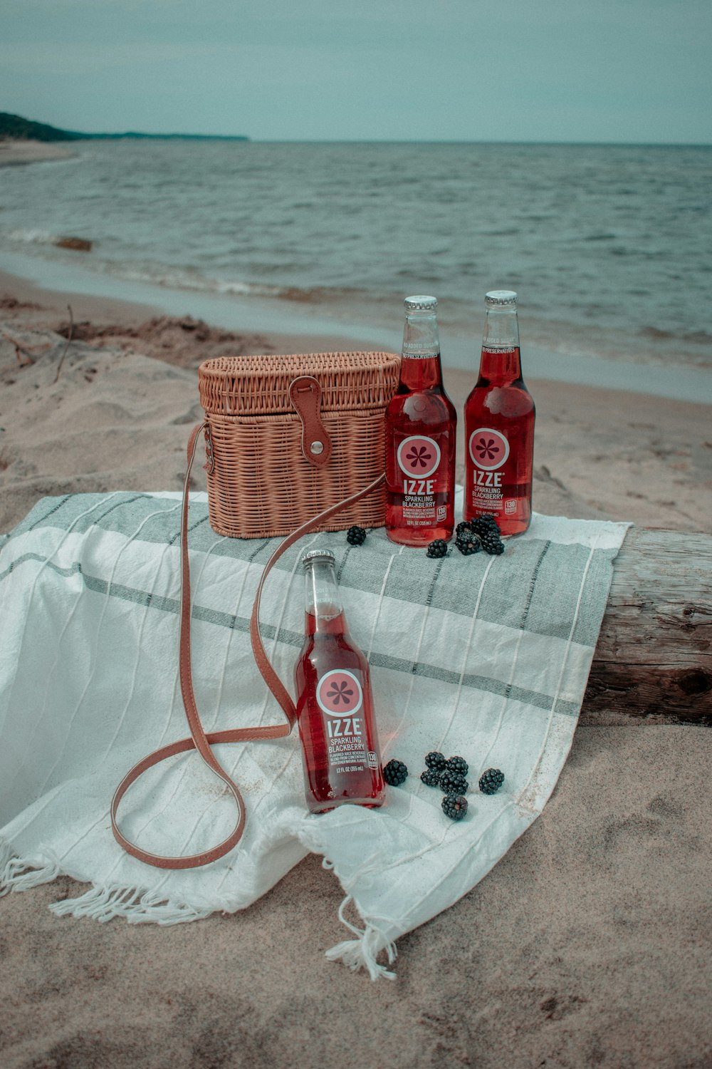 red plastic bottles on white textile