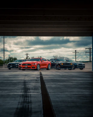 red chevrolet camaro on road during daytime