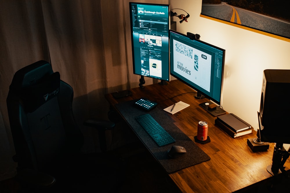 black flat screen computer monitor on brown wooden table