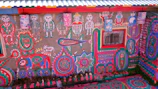 Vibrant mural painting on an exterior wall showcasing creative decorative techniques