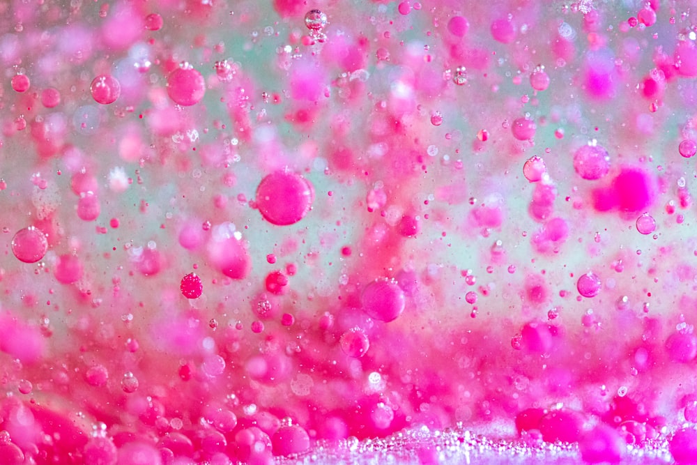 pink and white bubbles in water
