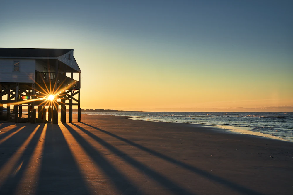 Driftwood House exterior at sunset, steps from the JBay shoreline.