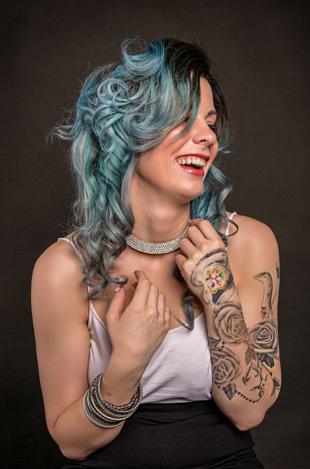 woman in white tank top with green hair