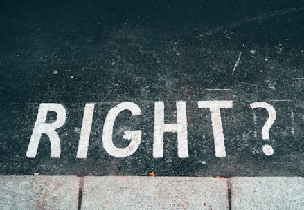 black and white stop road sign