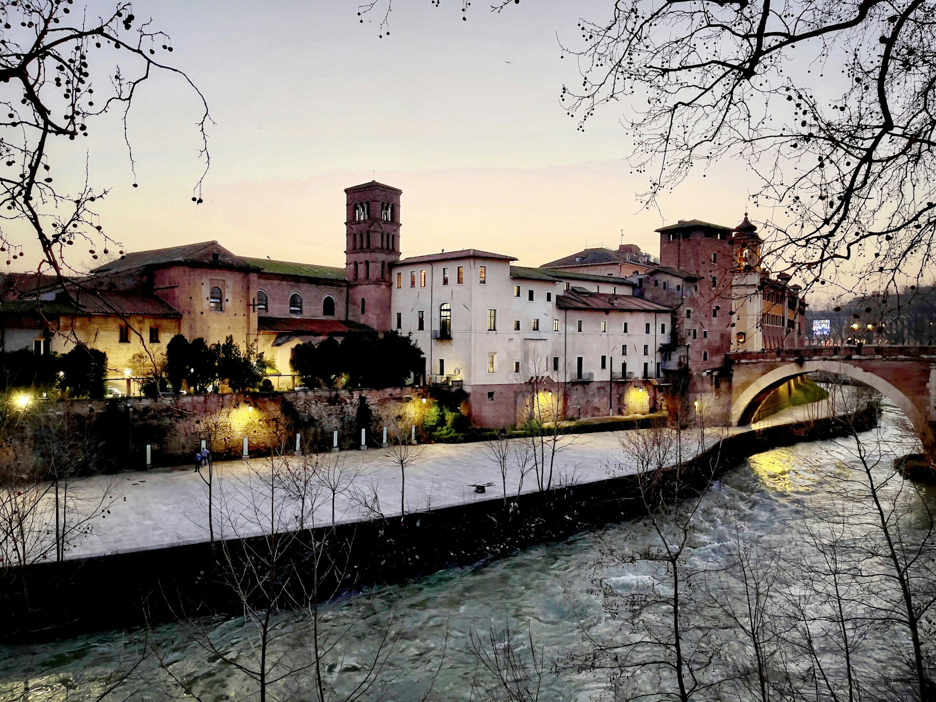 brown concrete building near river during daytime