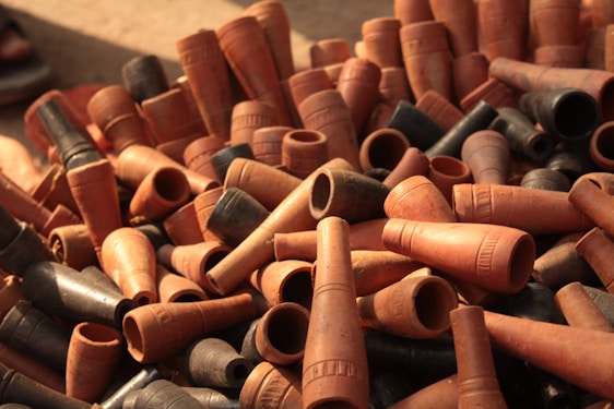 A diverse range of construction materials including pipes and tiles.