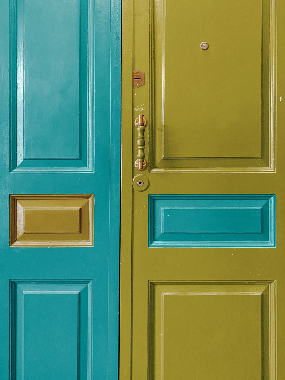 blue wooden door with silver door lever