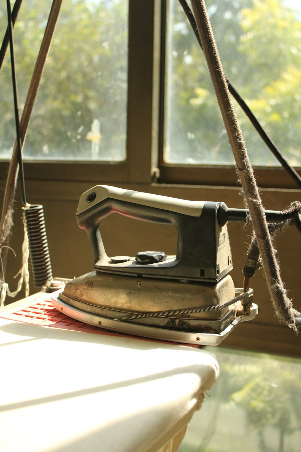 black and gray clothes iron on white and red textile