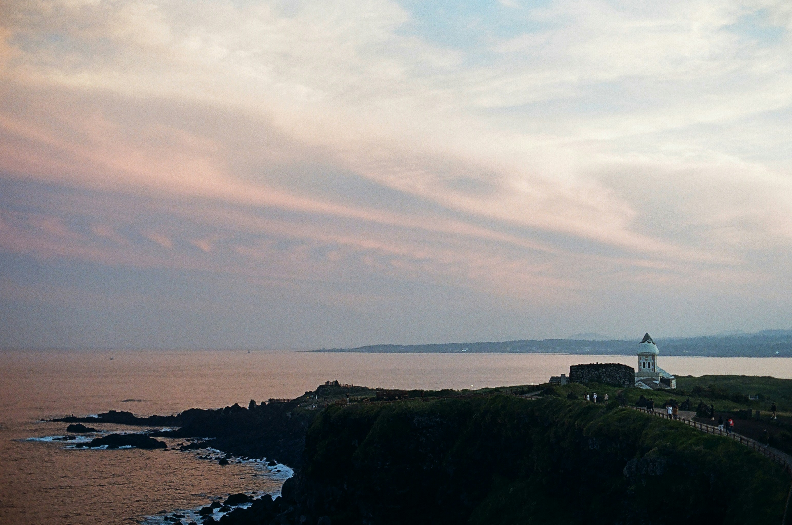 white and black house on top of mountain near body of water during daytime, Canon F-1 / Kodak Gold 200