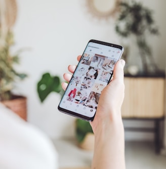 person holding white android smartphone