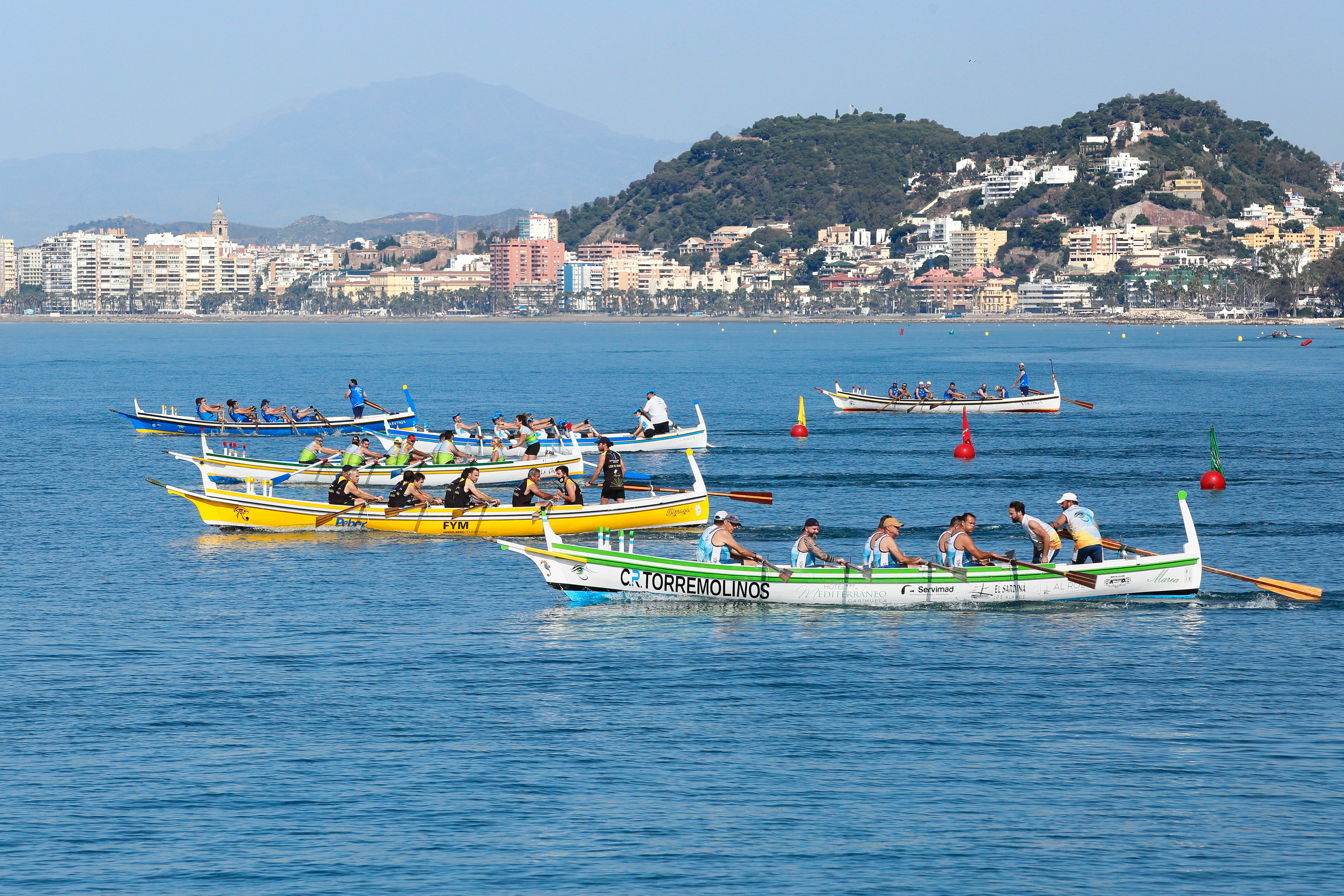 people riding on yellow kayak on sea during daytime