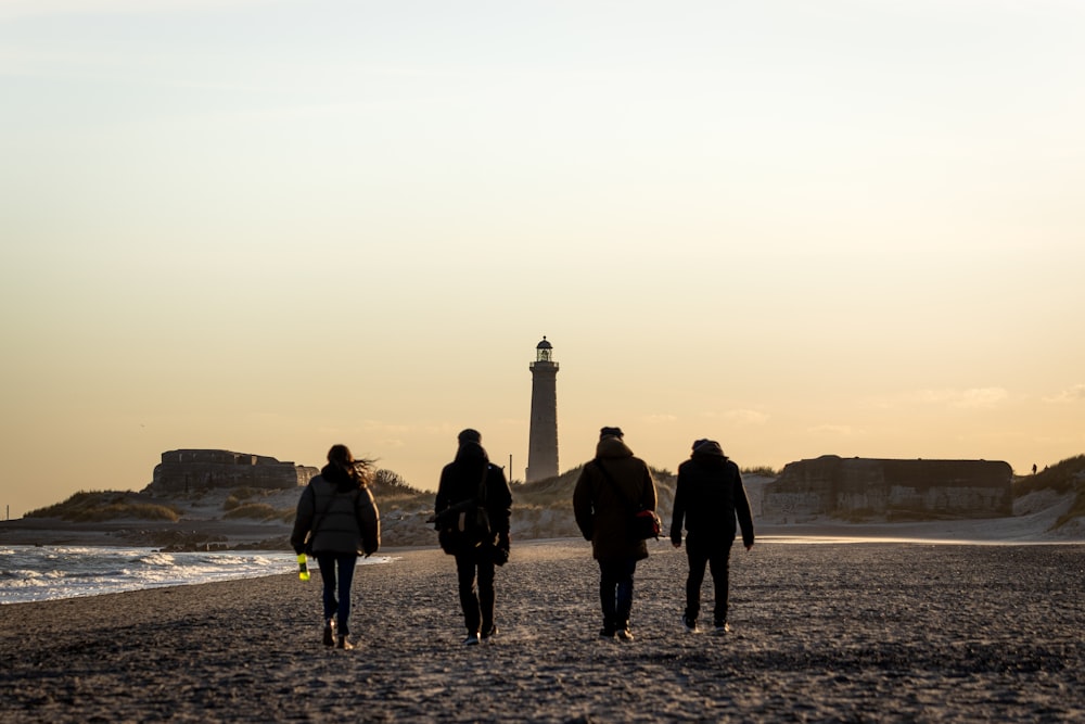 people walking on gray sand during daytime