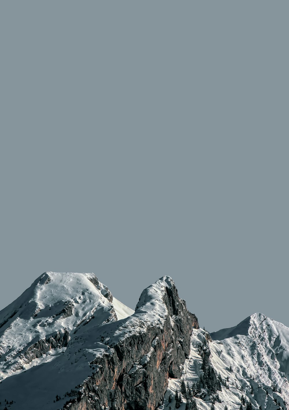 snow covered mountain under blue sky during daytime