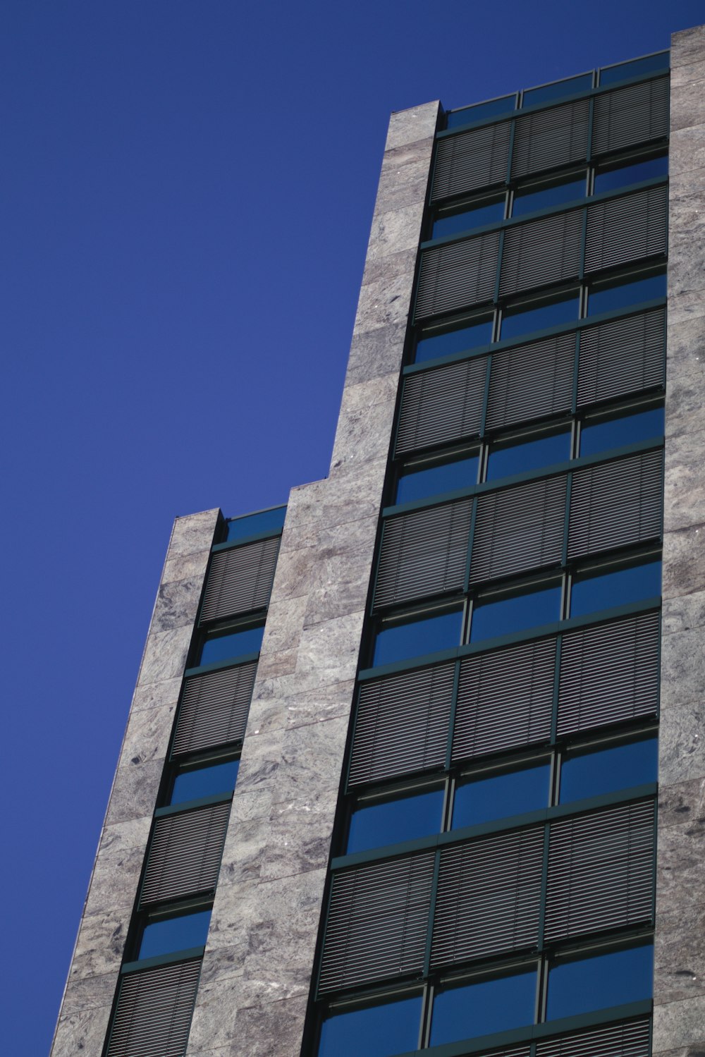 gray concrete building under blue sky during daytime