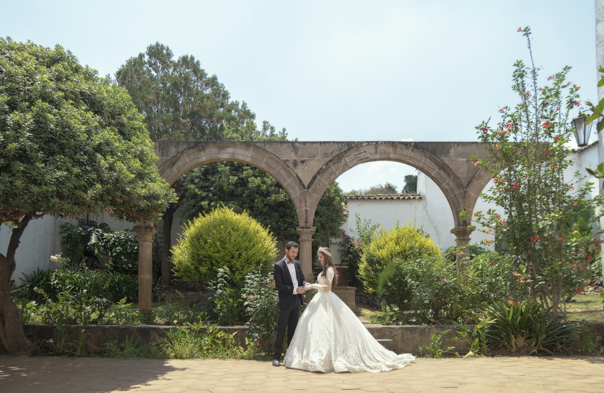 bride and groom standing on brown concrete floor during daytime