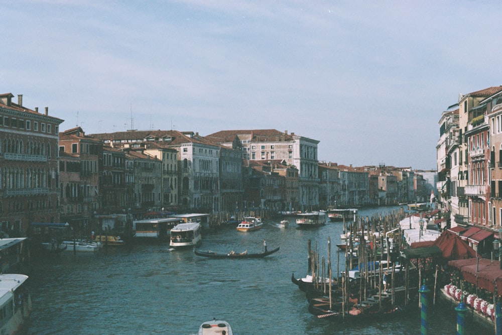 boat on water near buildings during daytime