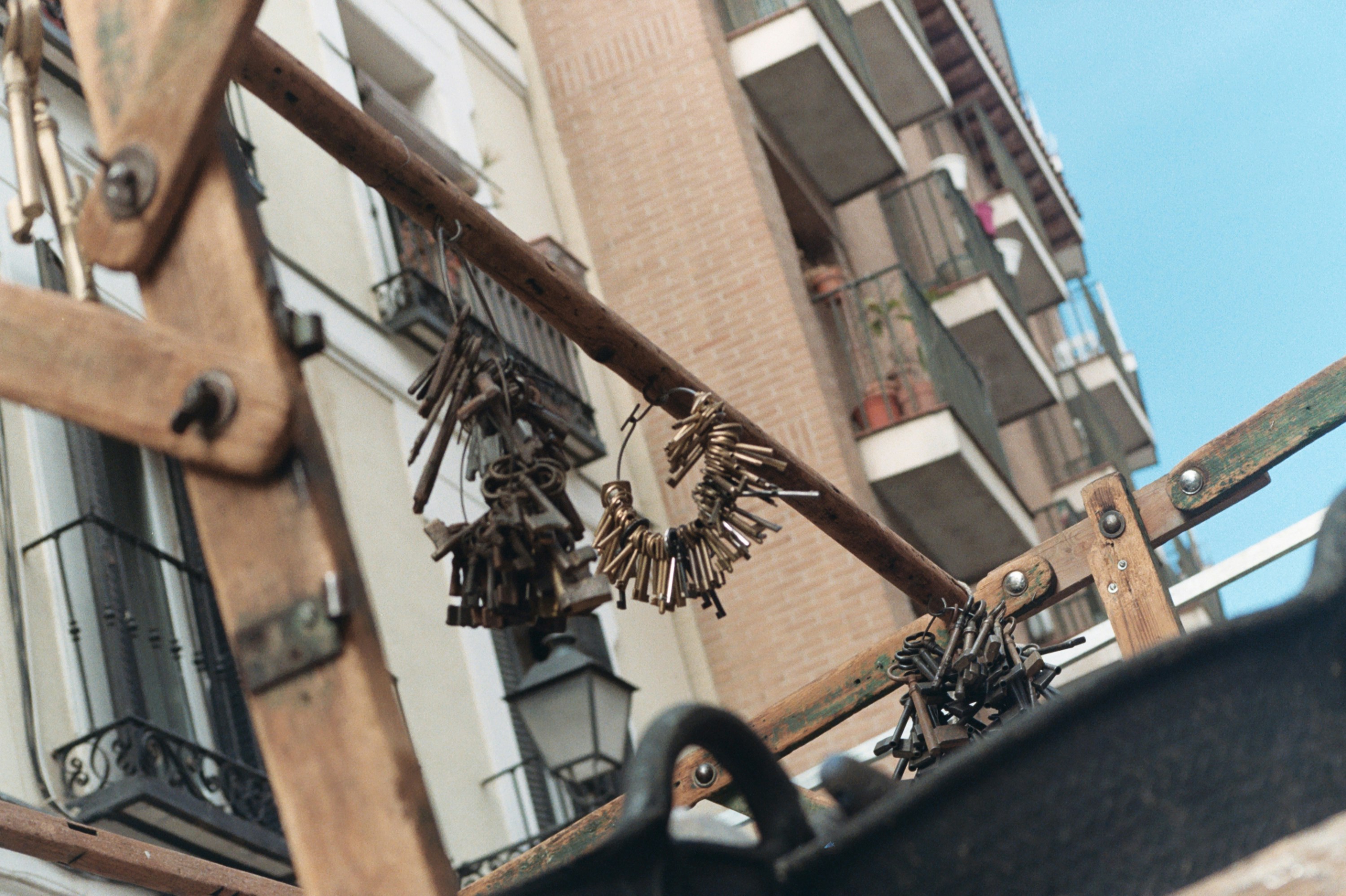 Bunch of keys hanging from a balcony rail