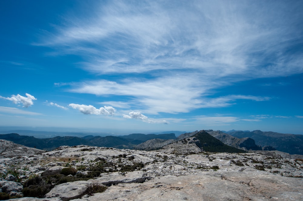 gray rocky mountain under blue sky during daytime