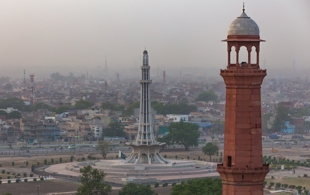 brown concrete tower during daytime, Minar-e-Pakistan and Minaret of Badshahi Masjid Lahore
