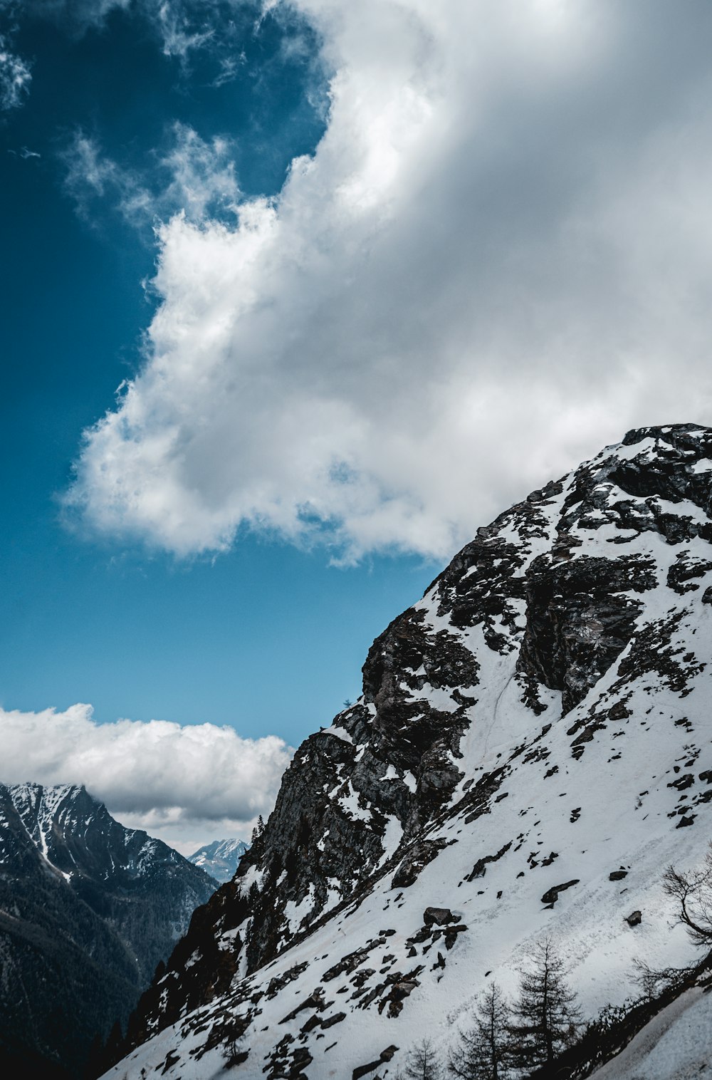 snow covered mountain under blue sky during daytime