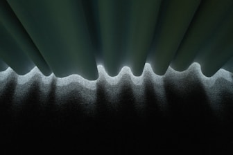 white plastic container on black wooden table